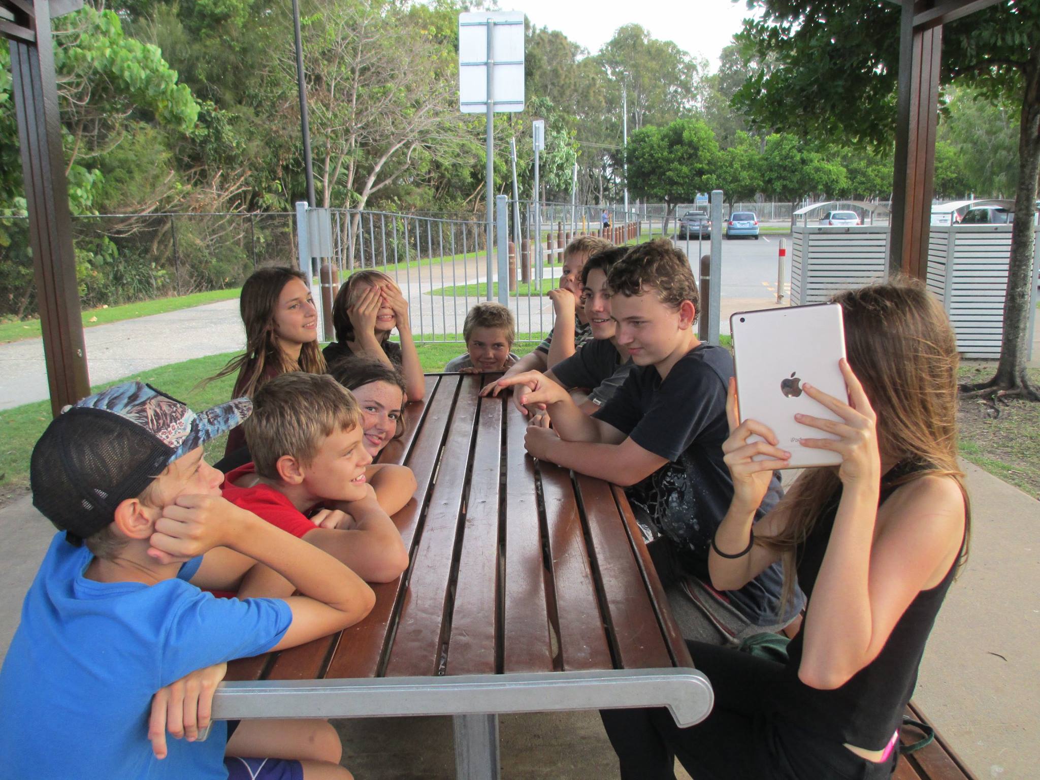 Teens gathered around a table